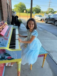 Girl at Howard the Piano