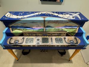 aerial view of painted piano with airport theme