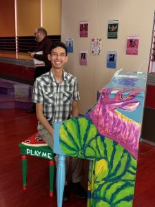 Man at piano painted in watermelon theme