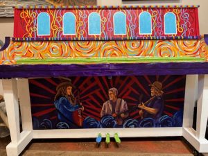 Painted piano showing Marvin King Revue on bottom